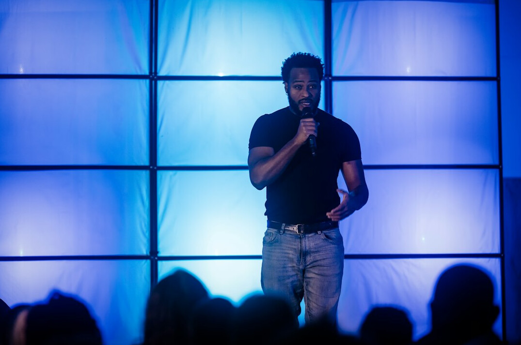 leader speaking on stage
