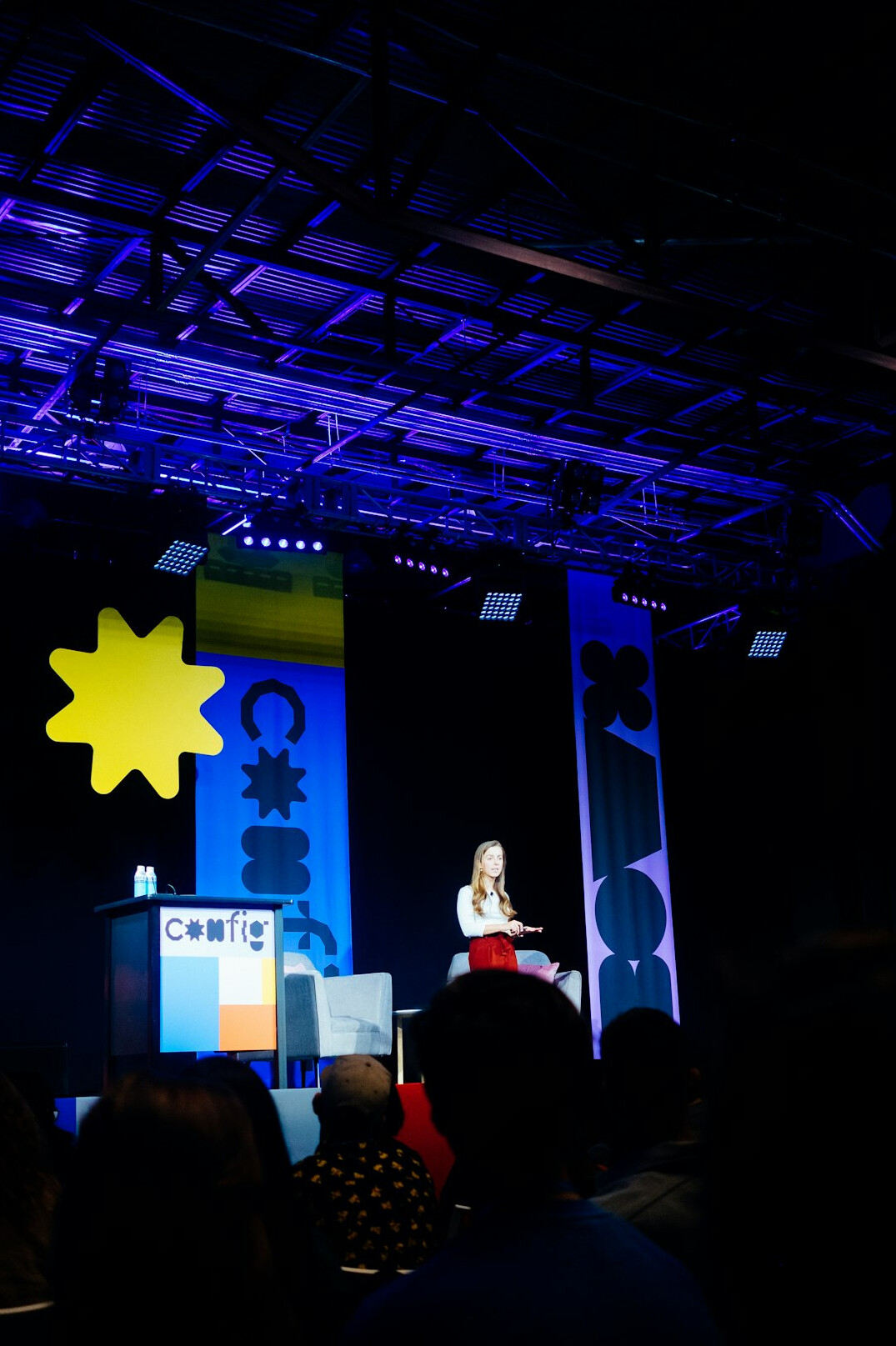 executive speaking on stage